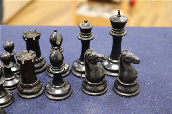 A Jaques Staunton boxwood and ebony chess set, knights and rooks stamped with a crown and the white king kings 8.5cm